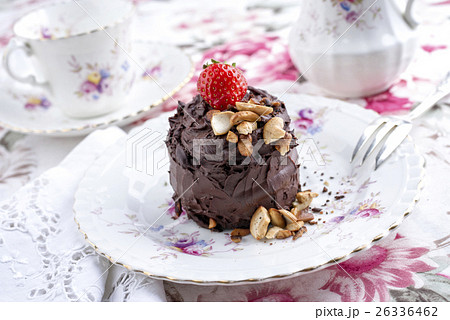 Chocolate Torte with Nuts and Strawberry on Plate 26336462