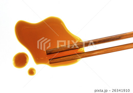 Soy sauce and chopsticks on white background 26341910