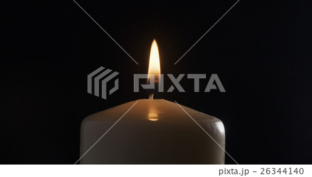 one burning candle, isolated on black 26344140