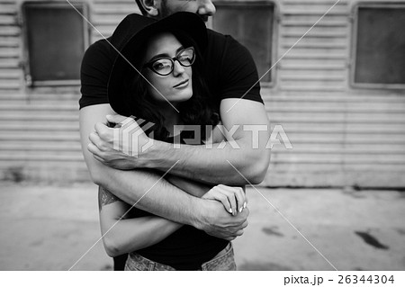 guy hugging his girlfriend from behind 26344304