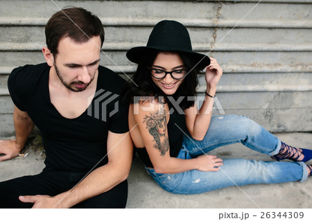 man and woman posing on a background gray wall man and woman posing on a background gray wall 26344309