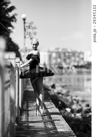 ballerina posing on a background of the lake ballerina posing on a background of the lake 26345132