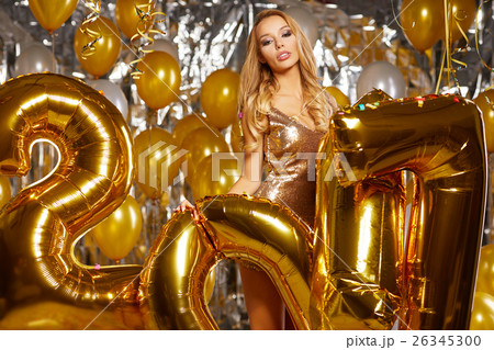 Beauty woman in gold dress  26345300