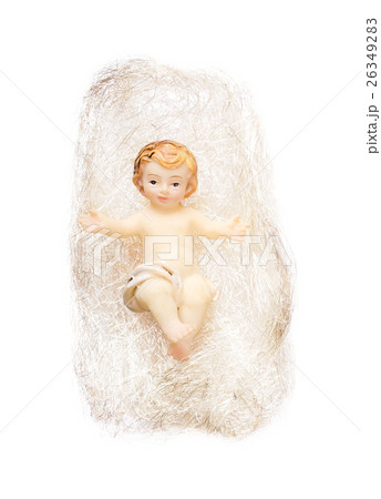 Christ child figurine in angel hair on white backg 26349283