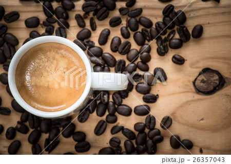 Espresso cup with coffee beans. Espresso cup with coffee beans. 26357043