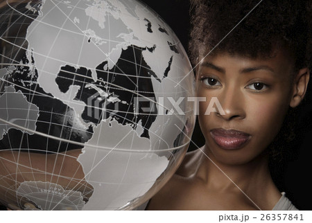 Young woman with transparent globe 26357841
