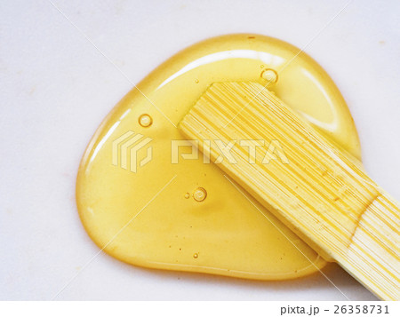 Honey and wooden stick Honey and wooden stick 26358731