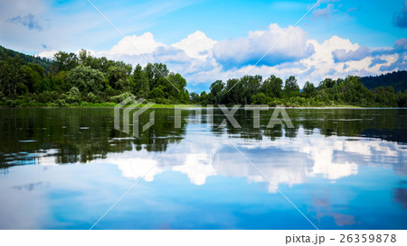 Beautiful landscape with cloudy blue sky reflected Beautiful landscape with cloudy blue sky reflected 26359878