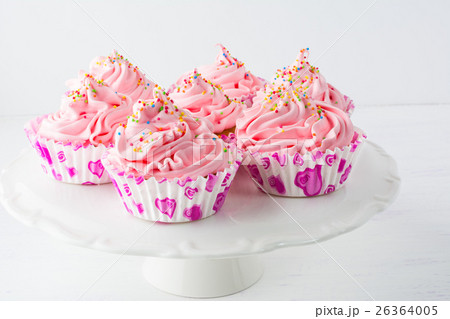 Decorated pink birthday cupcakes on the cake stand Decorated pink birthday cupcakes on the cake stand 26364005