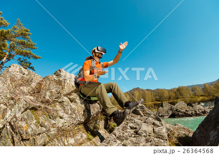 Successful young man, using virtual reality 26364568