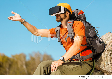 Successful young man, using virtual reality 26364600