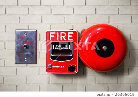 Fire alarm switch on brick wall texture background 26366019