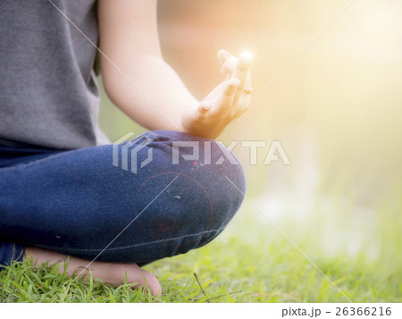 Young woman doing yoga in the park Young woman doing yoga in the park 26366216