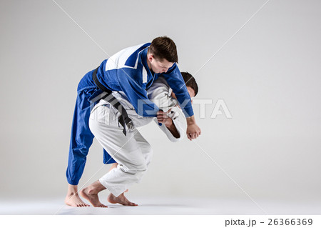 The two judokas fighters fighting men 26366369