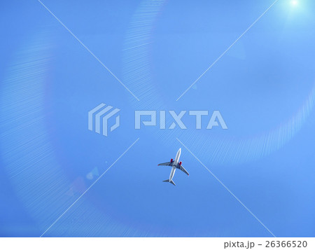 Flying plane in blue sky with sunray Flying plane in blue sky with sunray 26366520