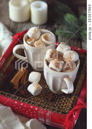 New Year marshmallows in two cups and candles 26367864