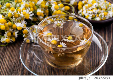 Cup of medicinal chamomile tea 26372854