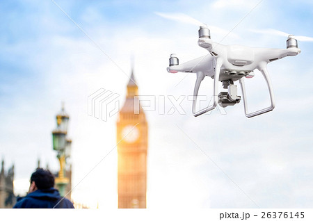 Hovering drone taking pictures of Big Ben in 26376145