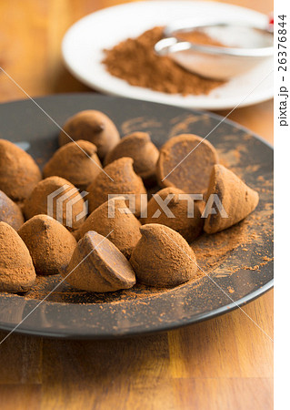 Sweet chocolate truffles and cocoa powder. Sweet chocolate truffles and cocoa powder. 26376844