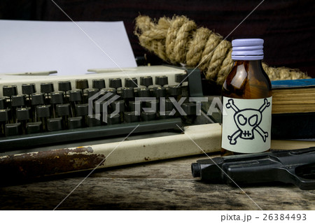 Typewriter with paper page and poison and gun Typewriter with paper page and poison and gun 26384493