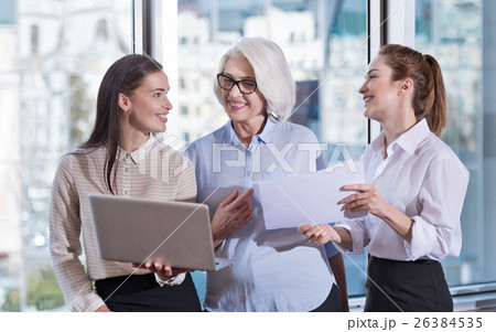 Young colleagues and their boss laughing together 26384535