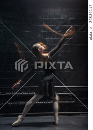Skilled dancer performing on the dark background 26386117