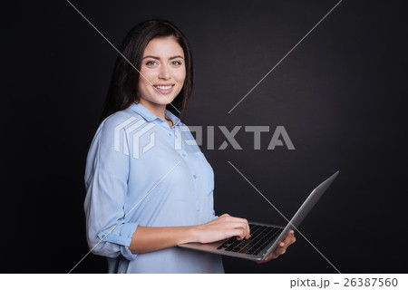 Joyful woman using laptop Joyful woman using laptop 26387560