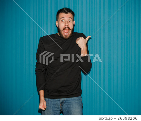 Portrait of young man with shocked facial 26398206