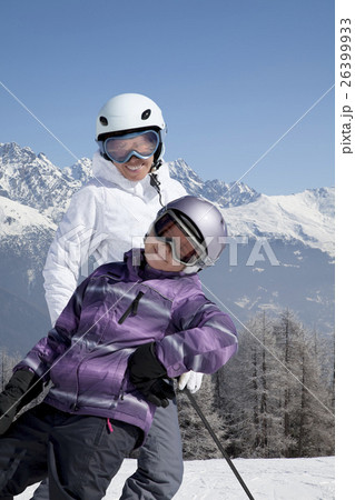 Mother and daughter posing happily 26399933