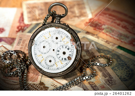 Old Pocket Watch and Paper Banknotes 26401262