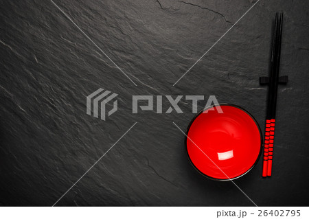 Two chopsticks and red plate on black Two chopsticks and red plate on black 26402795