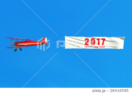 Flying airplane and Happy new year 2017 banner. 26410595