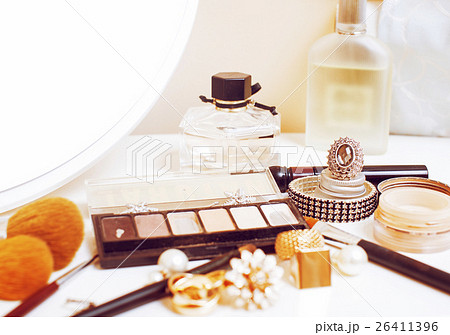 Jewelry table with lot of girl stuff on it, little 26411396