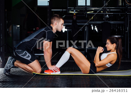 Woman doing abdominal crunches press exercise on Woman doing abdominal crunches press exercise on 26416351