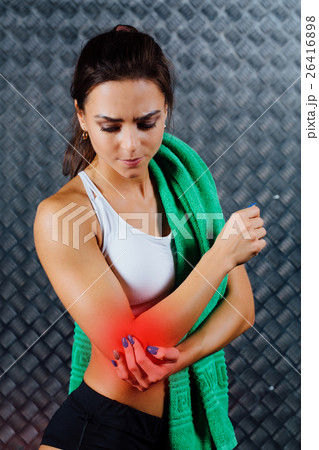Beautiful young fitness woman feeling pain. 26416898