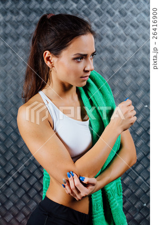 Beautiful young fitness woman feeling pain. 26416900