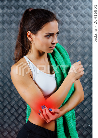 Beautiful young fitness woman feeling pain. 26416901