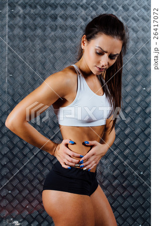 Beautiful young fitness woman feeling pain. Beautiful young fitness woman feeling pain. 26417072