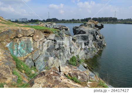 rocky lake with stone and cliff rocky lake with stone and cliff 26417427