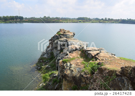 rocky lake with stone and cliff 26417428