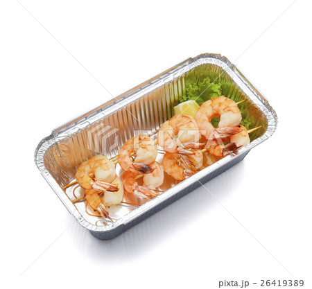 Delicious shrimp on skewers in box isolated Delicious shrimp on skewers in box isolated 26419389