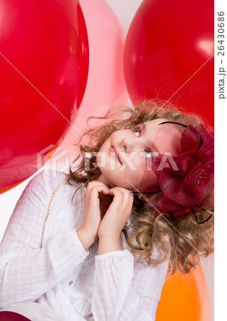 Surprised girl in red hat looking up 26430686