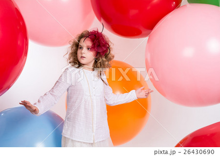 Teen girl in a hat and white dress on a background of big colore Teen girl in a hat and white dress on a background of big colore 26430690