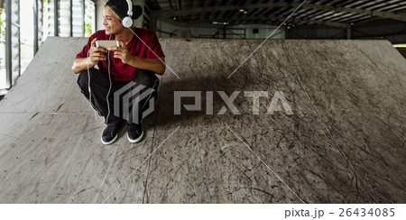 Teenager Style Listening Music Headphone Street Concept 26434085