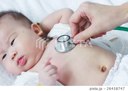 Pediatrician examining infant. Illness baby girl  26438747