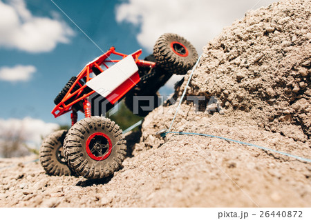 Suv overcoming rock rise, close-up. 26440872