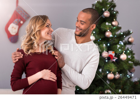 Loving happy husband looking at his pregnant wife 26449471