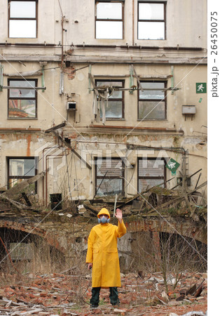 Man with protective mask explores danger area. Man with protective mask explores danger area. 26450075