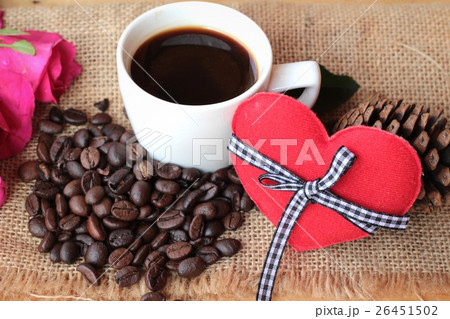 Coffee with coffee beans and red hearts. 26451502