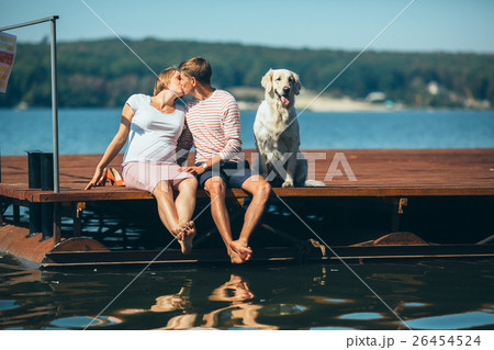 pregnant woman and her husband on the pier 26454524